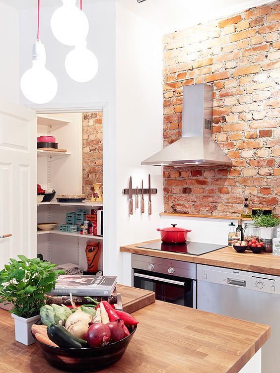 Little kitchen with brick wall