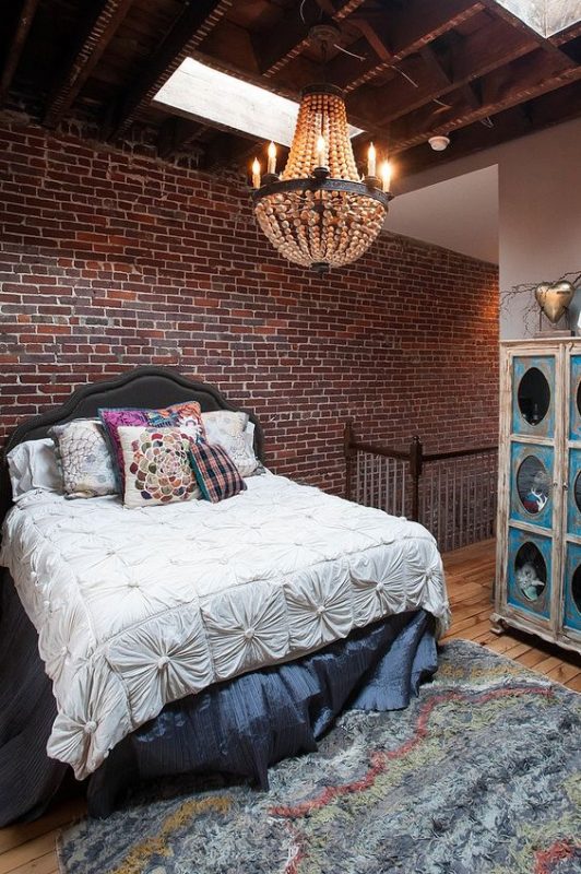 Contemporary bedroom with brick wall