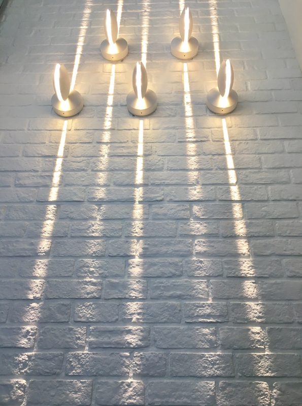 Downlight bespoke composition on brick wall