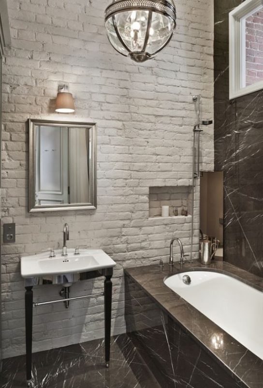 Rustic white brick wall adorning the stylish bathroom