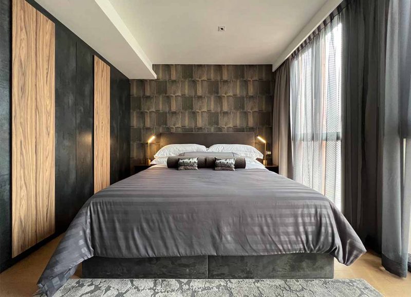 Guest bedroom. Custom-made metal laminate wardrobe and gray tone all around.