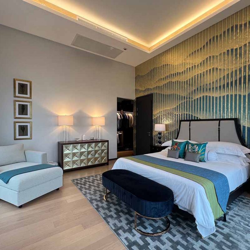 Master bedroom with italian special gold leaf wall paper. Classy and modern.