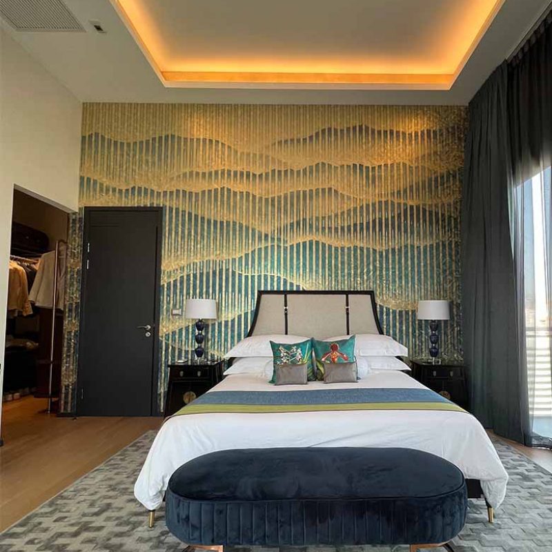 Master bedroom with italian special gold leaf wallpaper. The high ceiling has a LED downlight.