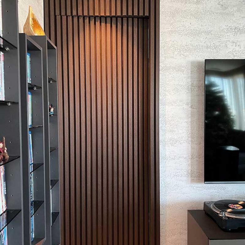 Hidden opening door with wall panels