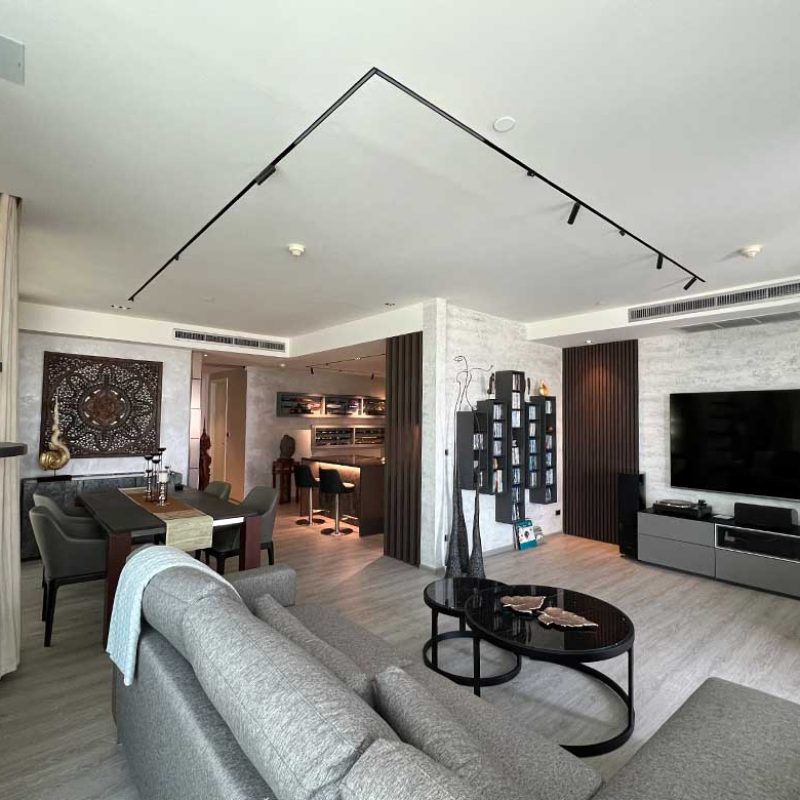 Living room with tv wall and dining table